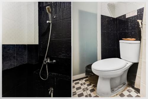 a bathroom with a toilet and a shower at Townhouse Oak Syariah Hotel Binjai in Medan