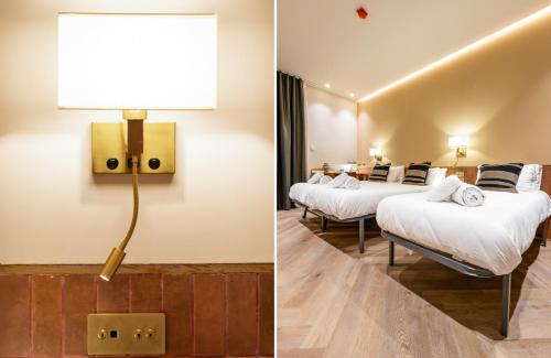 a hotel room with two beds and a lamp at Hostal Ambos Mundos in Barcelona