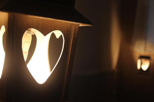 a close up of a light with a heart on it at Agli Chalet Erbe Montane con parcheggio privato in Domodossola
