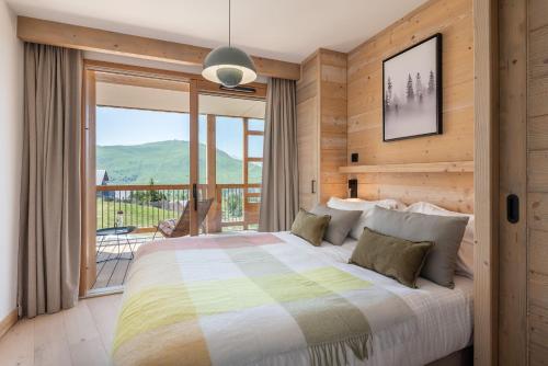 Postel nebo postele na pokoji v ubytování Apartment Sola Alpe D'Huez - by EMERALD STAY