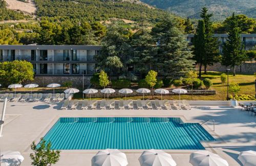 an aerial view of a hotel with a pool and chairs at Bluesun Holiday Village Bonaca - Full Board Plus in Bol