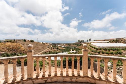 a bridge with a view of the amphitheater at MalagaSuite Villa Rural Madeira in Algarrobo