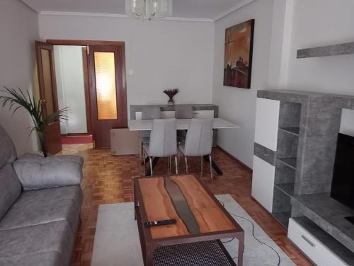 a living room with a couch and a table at Chillout La Rioja in Haro