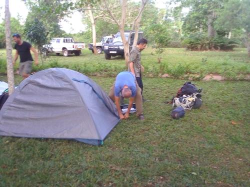 a group of people standing around a tent at Kibale Cultural Homestay in Fort Portal