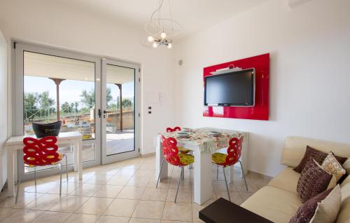 a living room with a table and a couch at Amazing Home In Belmonte Calabro in Belmonte Calabro