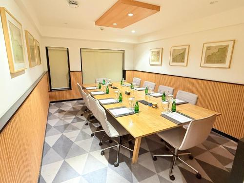 a conference room with a long table and chairs at Holiday Inn Gurgaon NH8 by IHG in Gurgaon