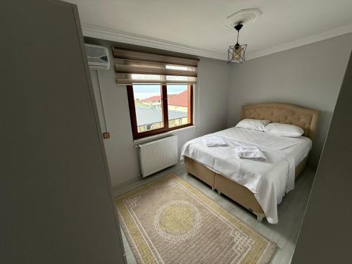 Katil atau katil-katil dalam bilik di Bektaş Residence