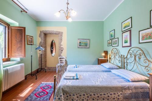 Ένα ή περισσότερα κρεβάτια σε δωμάτιο στο Agriturismo Paugnano