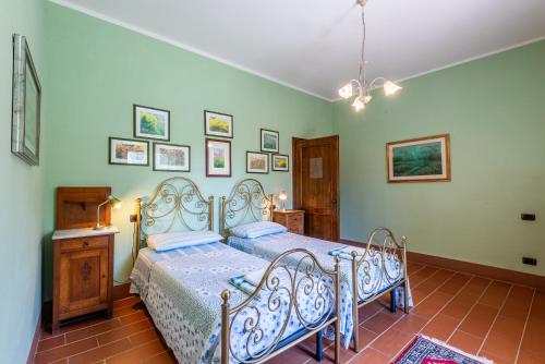 Ένα ή περισσότερα κρεβάτια σε δωμάτιο στο Agriturismo Paugnano