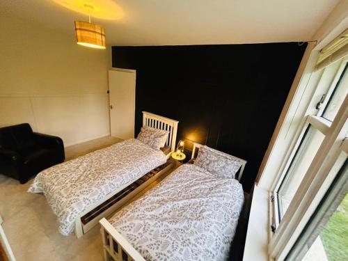 Ένα ή περισσότερα κρεβάτια σε δωμάτιο στο Stylish 2-Bedroom Modern Flat