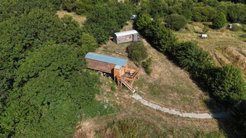 an aerial view of a train car with a house on it at Ferme de Pitoué in Campbon