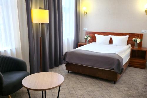 Postel nebo postele na pokoji v ubytování Hotel Piast Wrocław Centrum
