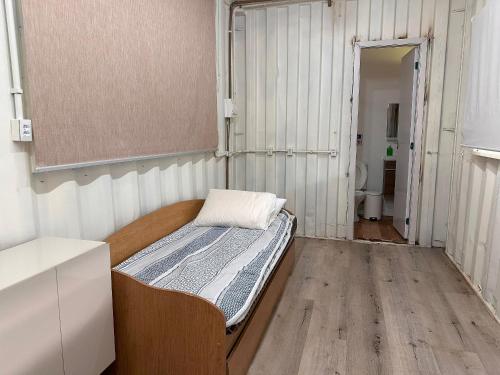 Ένα ή περισσότερα κρεβάτια σε δωμάτιο στο Flat da Cassia Eller na Villela Home Stay Lago Sul DF