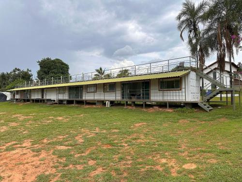 a building with a staircase on the side of it at Flat da Cassia Eller na Villela Home Stay Lago Sul DF in Brasilia