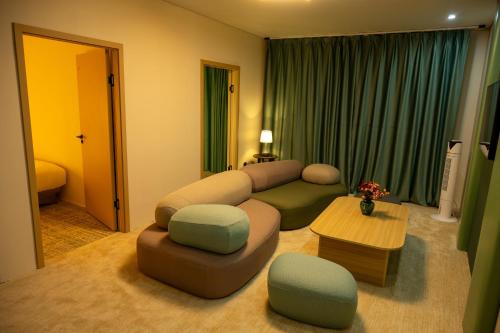 a living room with a couch and a table at MSInternational Hotel in Ulaanbaatar