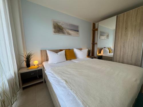 Ένα ή περισσότερα κρεβάτια σε δωμάτιο στο Käptn Brass Appartement 14 Meeresbrise