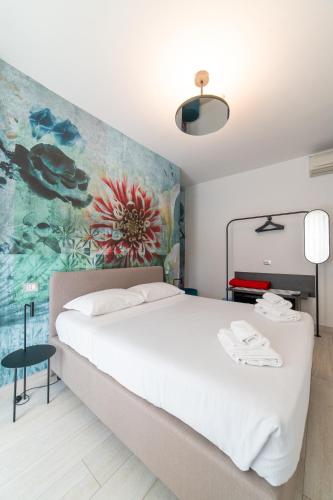Una cama o camas en una habitación de Lilium Maris Hotel