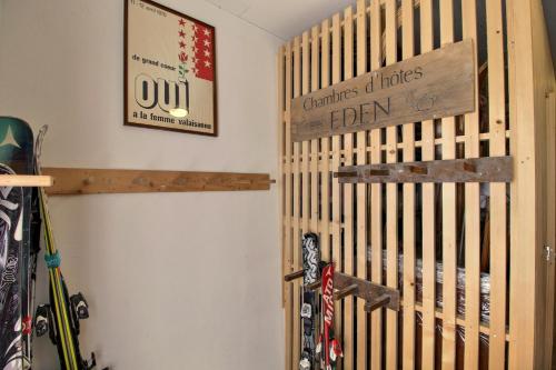 a room with skis on a wall next to a shelf at Chalet Eden, 4 Story Family Chalet in Champéry
