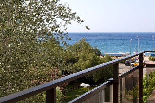 a view of the ocean from a balcony at Suites del Mar Fenals Apartments in Lloret de Mar