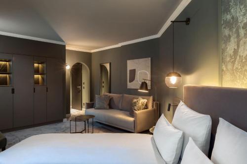 Tempat tidur dalam kamar di ERIKA Boutiquehotel Kitzbühel