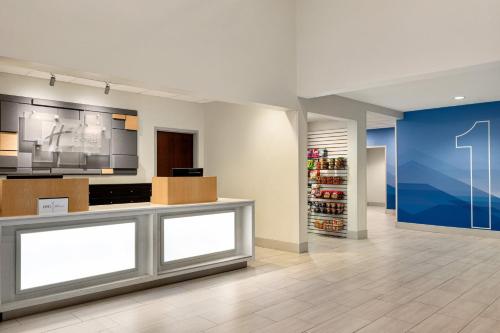 a lobby of a store with a pharmacy at Holiday Inn Express & Suites Lexington North West-The Vineyard by IHG in Lexington