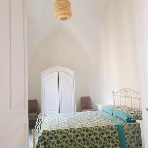 En eller flere senge i et værelse på D'OSPINA SALENTO APARTMENt