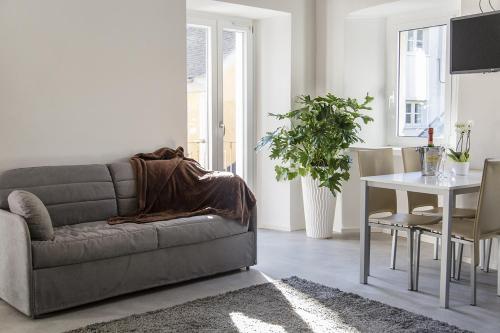 a living room with a couch and a table at Ca Bussun in Domodossola