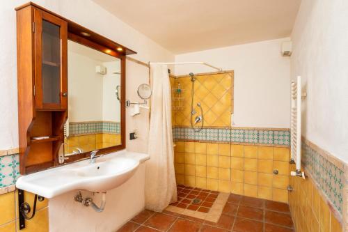 a bathroom with a sink and a shower at Agriturismo Terrenia in Taormina