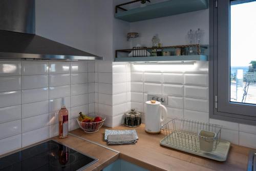 a kitchen with a sink and a counter top at Villa Akalli in Frangokastello