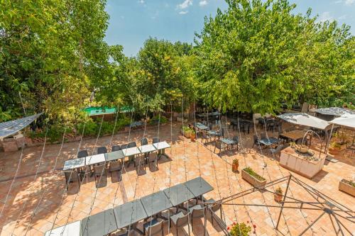 an overhead view of a patio with tables and chairs at Agriturismo Terrenia in Taormina