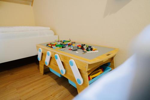 a small table in a room with a bed at Brioni Hills - Premium Escape in Šmarje pri Jelšah