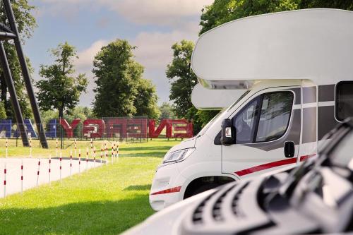 a white van parked next to a field at Encar - Bliżej nie będzie in Zator