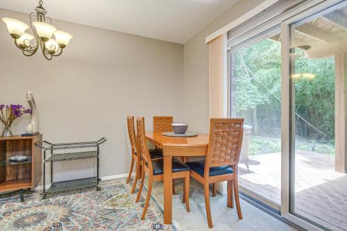 a dining room with a wooden table and chairs at Less Than 25 Mi to Downtown Baltimore and DC Apt with Deck in Columbia