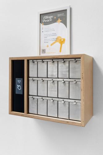 a wooden cabinet with twelve drawers on a wall at Penzion Village Peace #29 by Goodnite cz - U Libušky in Brno