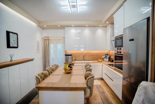 a kitchen with a table with bananas on it at NS Villa Kastrosykia in Pídima Kyrás