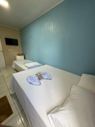 Postel nebo postele na pokoji v ubytování Pousada Lagoa Azul