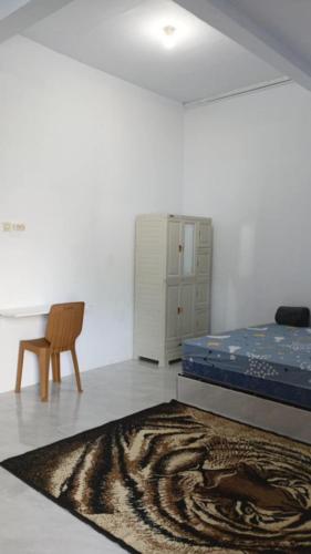 a room with a bed and a zebra rug at Touchsmart in Lemahabang