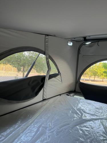 a view of the back seat of a car with the roof open at Fantástica Autocaravana California 2024 in Palma de Mallorca