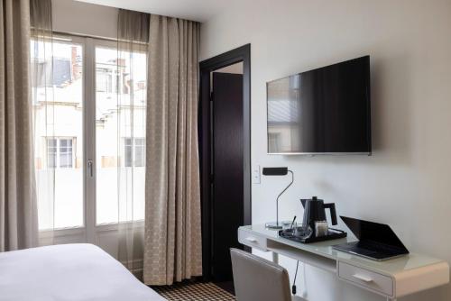 Hôtel Félicien & Spaにあるテレビまたはエンターテインメントセンター