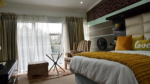 Postel nebo postele na pokoji v ubytování Sizanazo Guest House - Family Suite