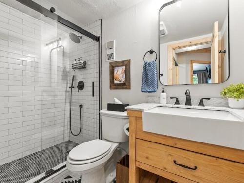 a bathroom with a toilet and a sink and a shower at Ski In and Out, Luxury, 1 Blk to Main, Pool, Hot Tub, Sauna in Breckenridge