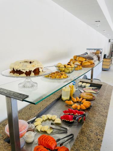 a buffet line with many different types of food at Verde Mar Pipa Beach in Pipa