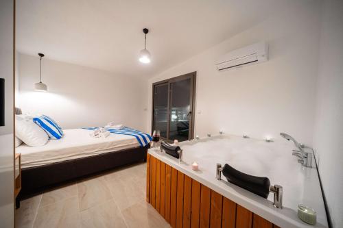 Katil atau katil-katil dalam bilik di Kas Pera Villas