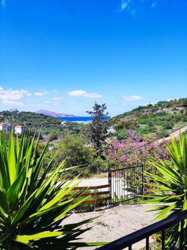 a view of the ocean from the balcony of a house at Georgia's Dream House in Koprána
