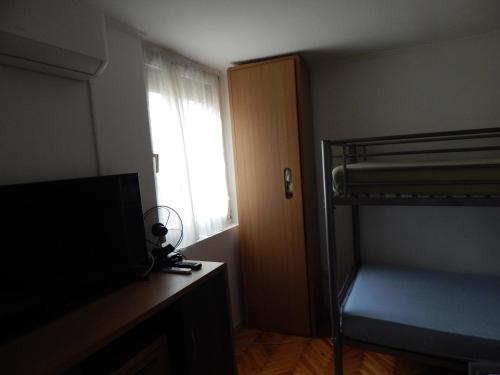 Postel nebo postele na pokoji v ubytování LiMa Apartman Ház