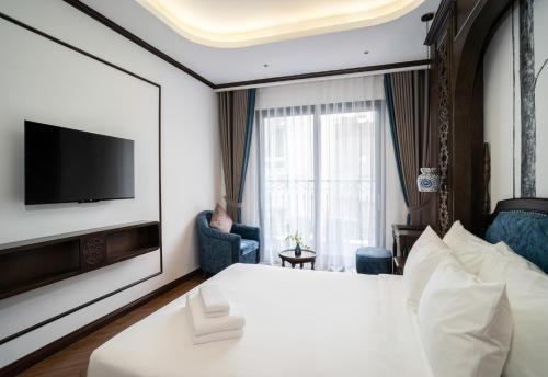 TV a/nebo společenská místnost v ubytování Eli Suites