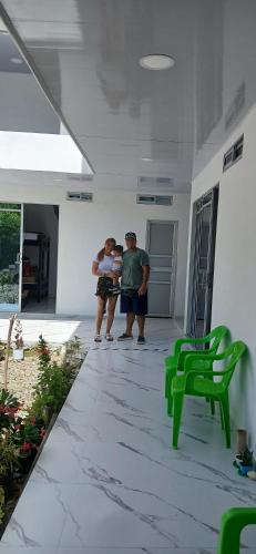 two people standing in a hallway of a house at hotel vivo por ella in Capurganá