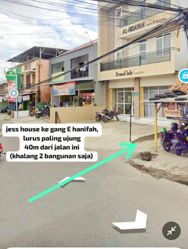 a screenshot of a street with an arrow pointing to a building at Jess House by Slamet in Padayungan