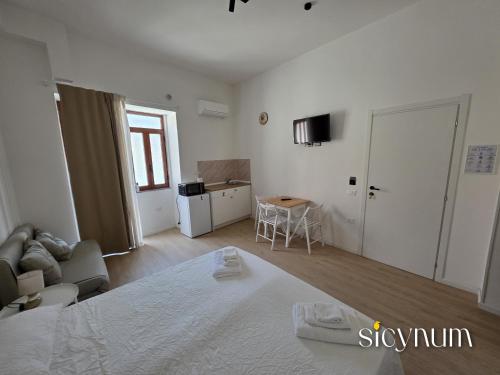 Ένα ή περισσότερα κρεβάτια σε δωμάτιο στο Sicynum