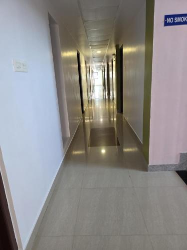 a hallway in a building with a no smoking sign at Sulthan Hotel & Restaurant in Cochin